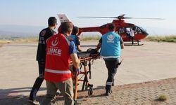 Dağlık alana düşen paraşütçü ambulans helikopterle hastaneye sevk edildi