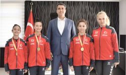 DİDİMLİ MİLLİ SPOR­CU­LAR KAY­MA­KAM KU­RU­CA’YI ZİYARET ETTİ